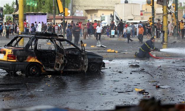 Car bomb kills 10 at busy Baghdad intersection: officials