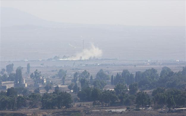 Syria army, rebels clash as UN bids to free Golan monitors