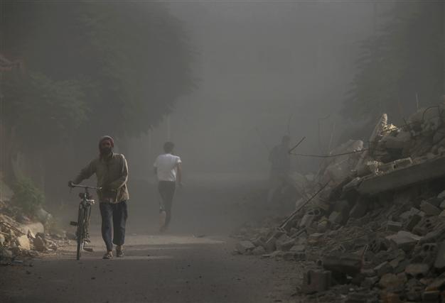 Syria air strikes kill dozens in rebel town: monitor