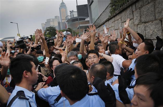 Tensions rise in HK as government tells protesters to disperse