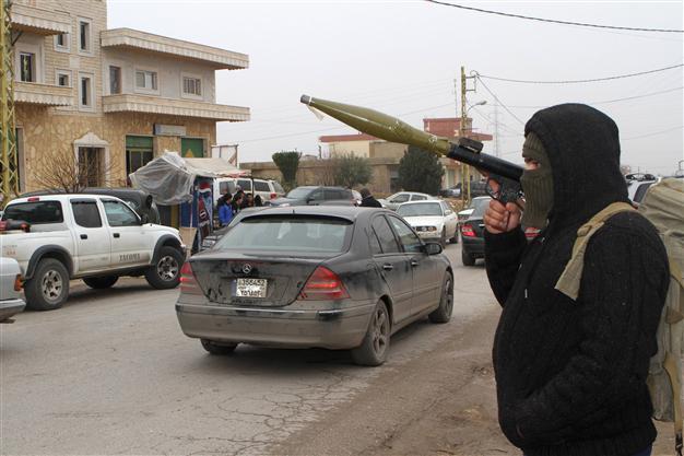 Around 180 Syrian soldiers, jihadists killed in battle for base