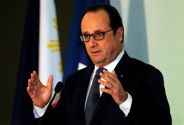 Hollande condemns French lawmakers meeting dictator Assad