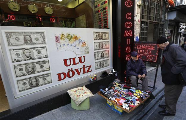 Turkey’s lira hits record low on rate cut expectations