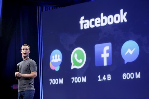 Facebook profit down but revenues, user base grow