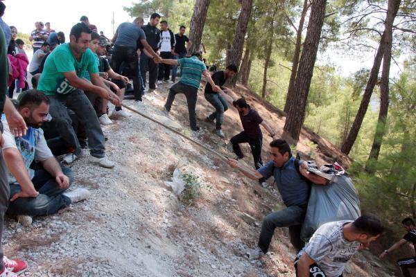 VIDEO: 130 Syrian migrants seeking seasonal work found in Aegean woods