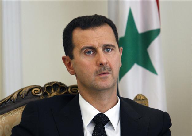 Assad says only Syrian people can decide if he quits