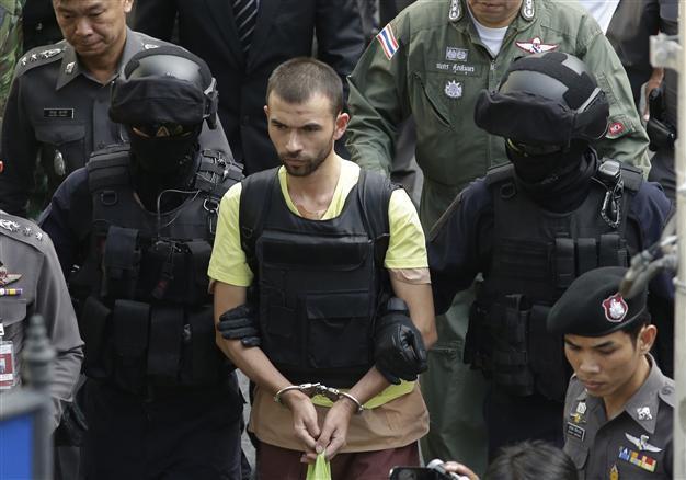 Thai police lead key suspects to Bangkok bomb site for re-enactment