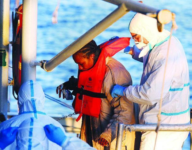 Italy rescues 2,400 boat migrants, finds three corpses