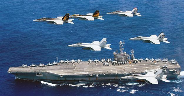 China to hold drills in disputed waters ahead of court ruling