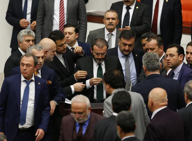 Parliament approves three more articles amid heated brawl