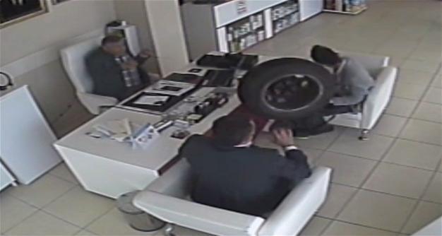 VIDEO: Tire plunges into pharmacy, injures two people in Turkeys Adana