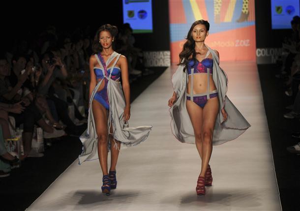 Models present creations by Colombian brand Leonisa during the