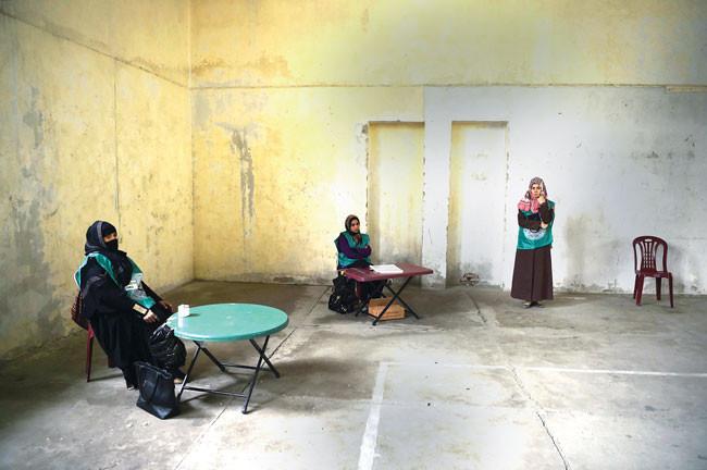 Afghans register to vote in long-delayed elections amid violence