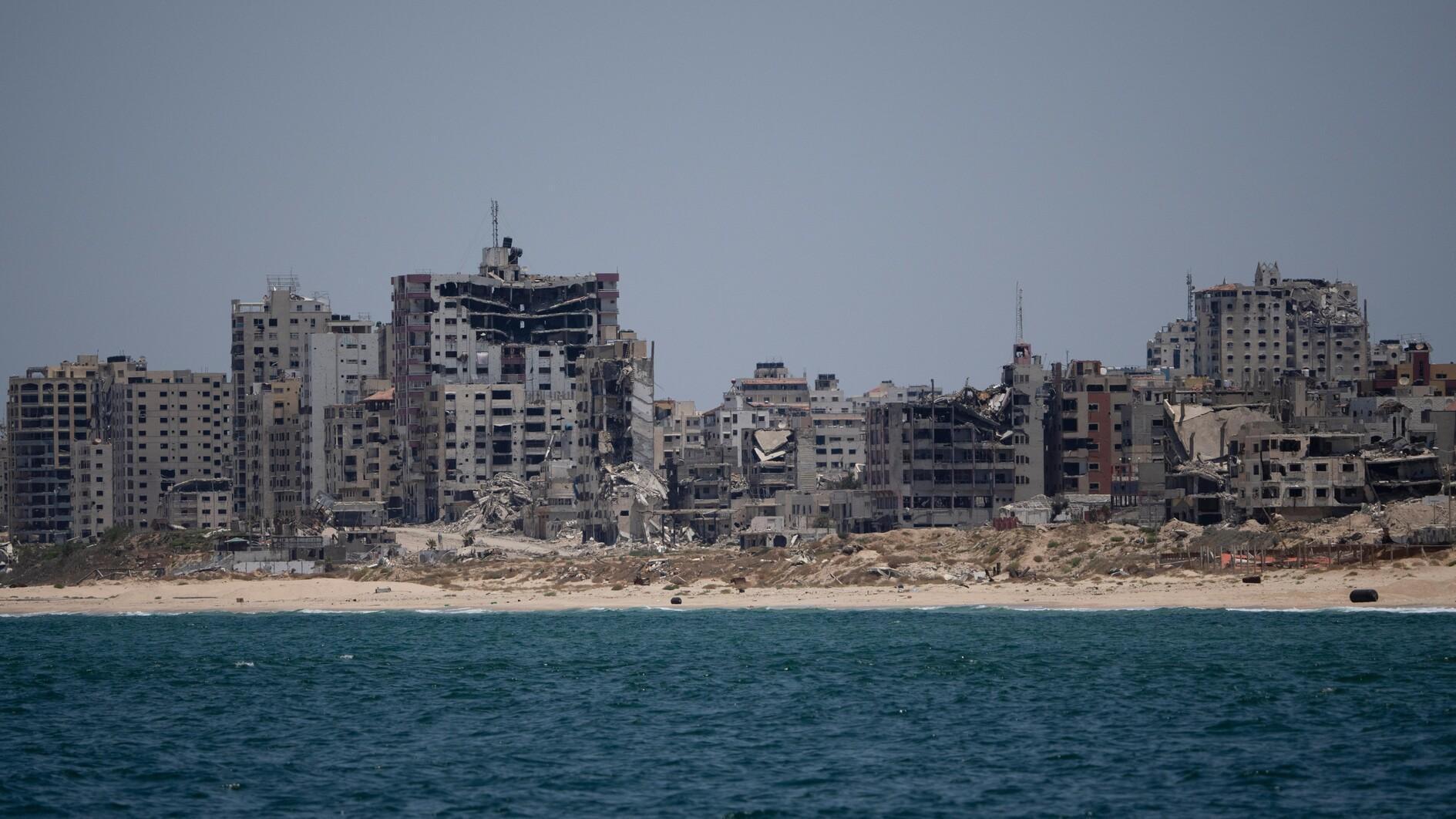 US aid pier removed due to high seas as Israeli strikes rock north Gaza ...