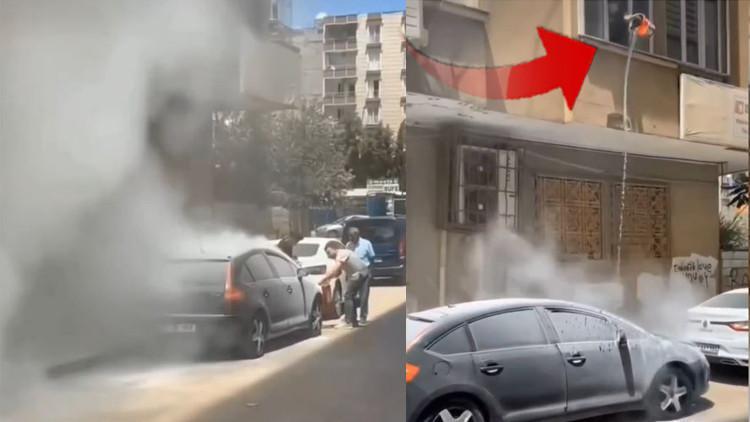 Yanan otomobilini bakın nasıl söndürmeye çalıştı! Mardin'de ilginç olay kamerada...