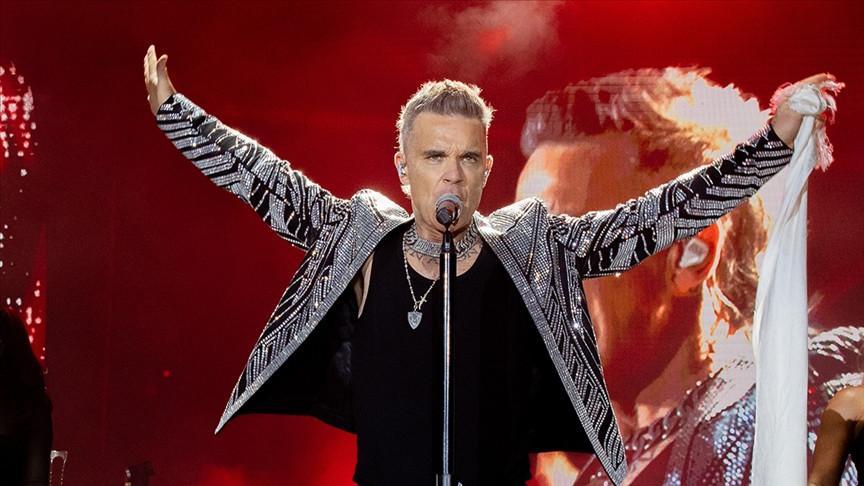Robbie Williams tops Beatles with record UK number one albums