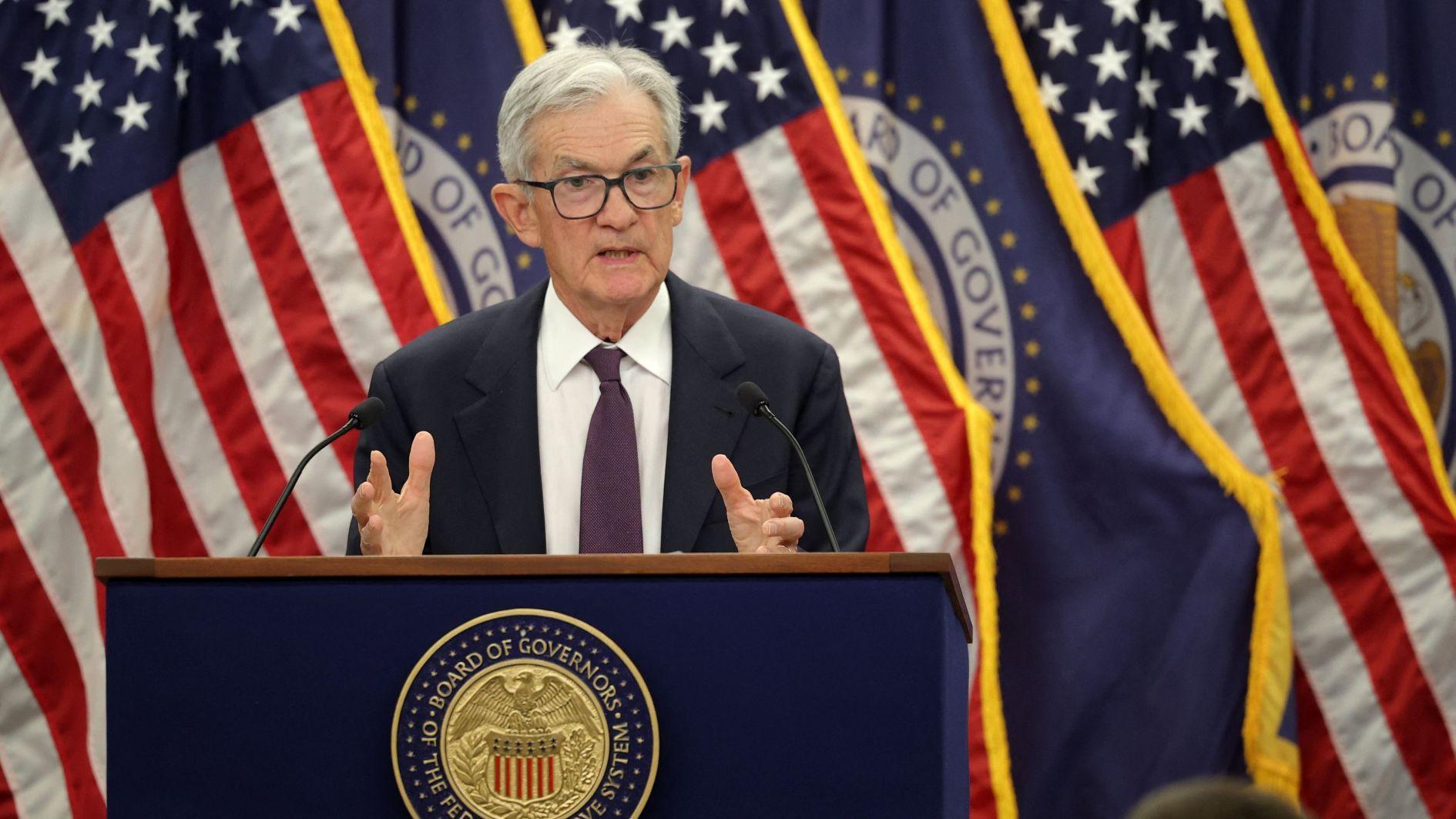 US Fed holds interest rates steady, defying Trump pressure