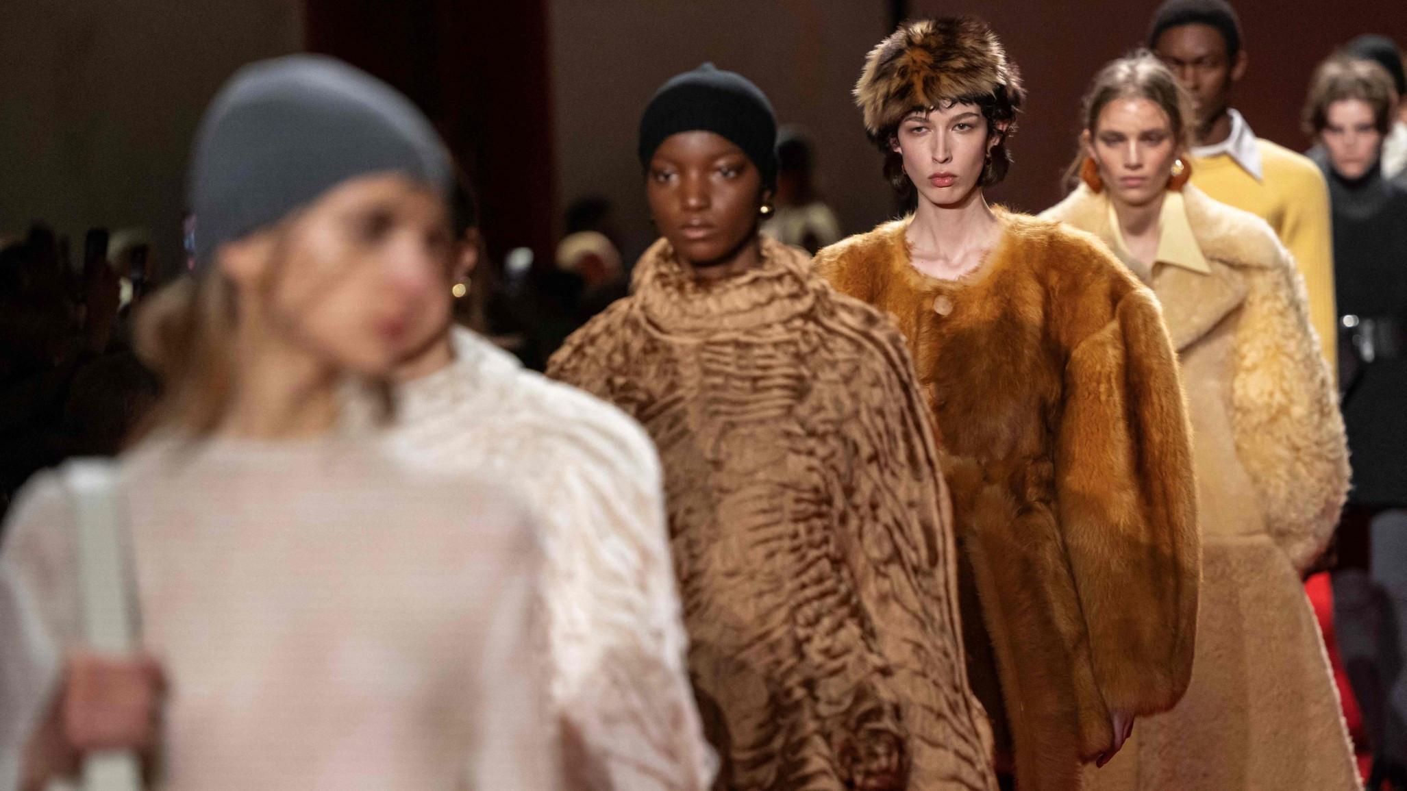 Milan runways highlight faux fur, backless designs, frayed fabrics