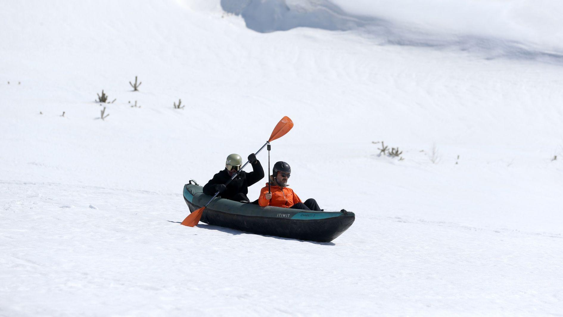Kayakers glide over snow at Mount Erciyes in unusual winter experiment
