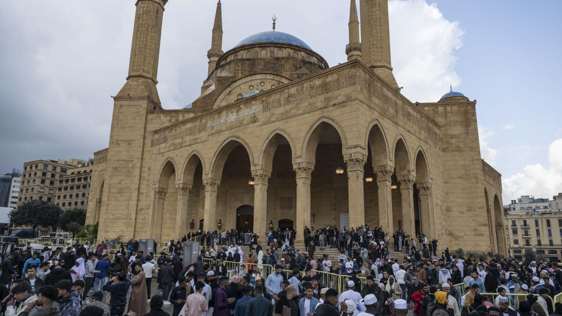 Displacement, air raid sirens weigh on Mideast Eid celebrations