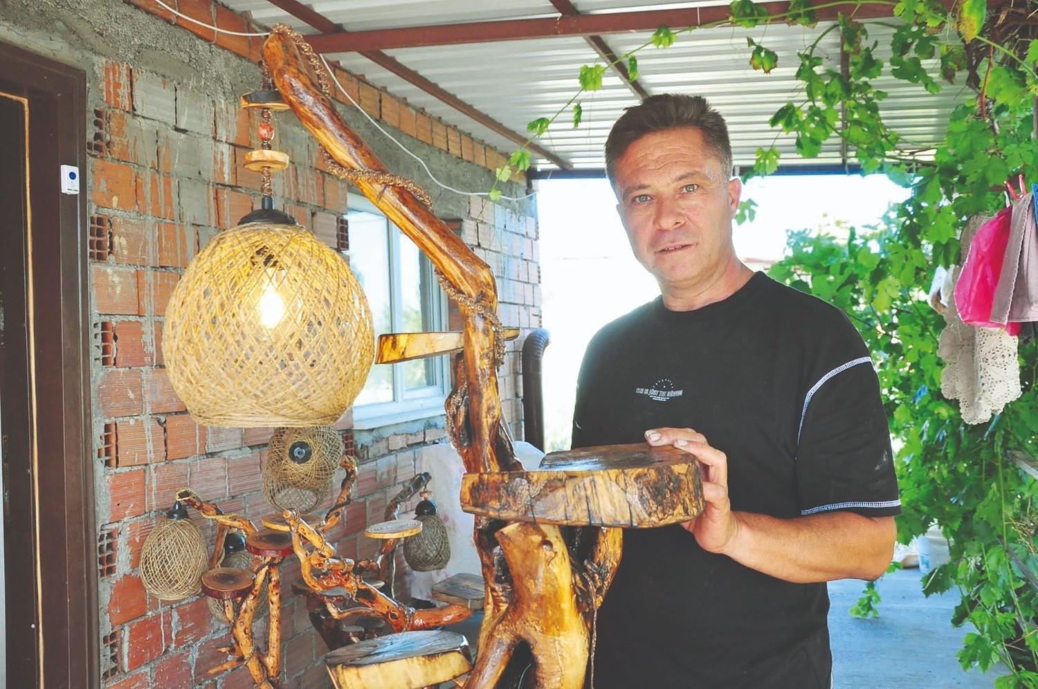 Aigai guard transforms discarded wood into art