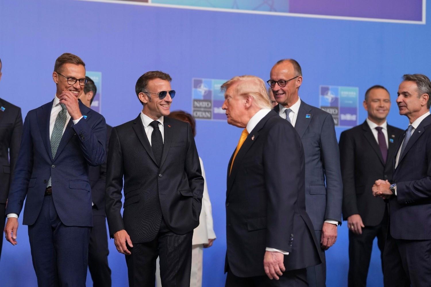 Trump tempers fury to end NATO summit on high note