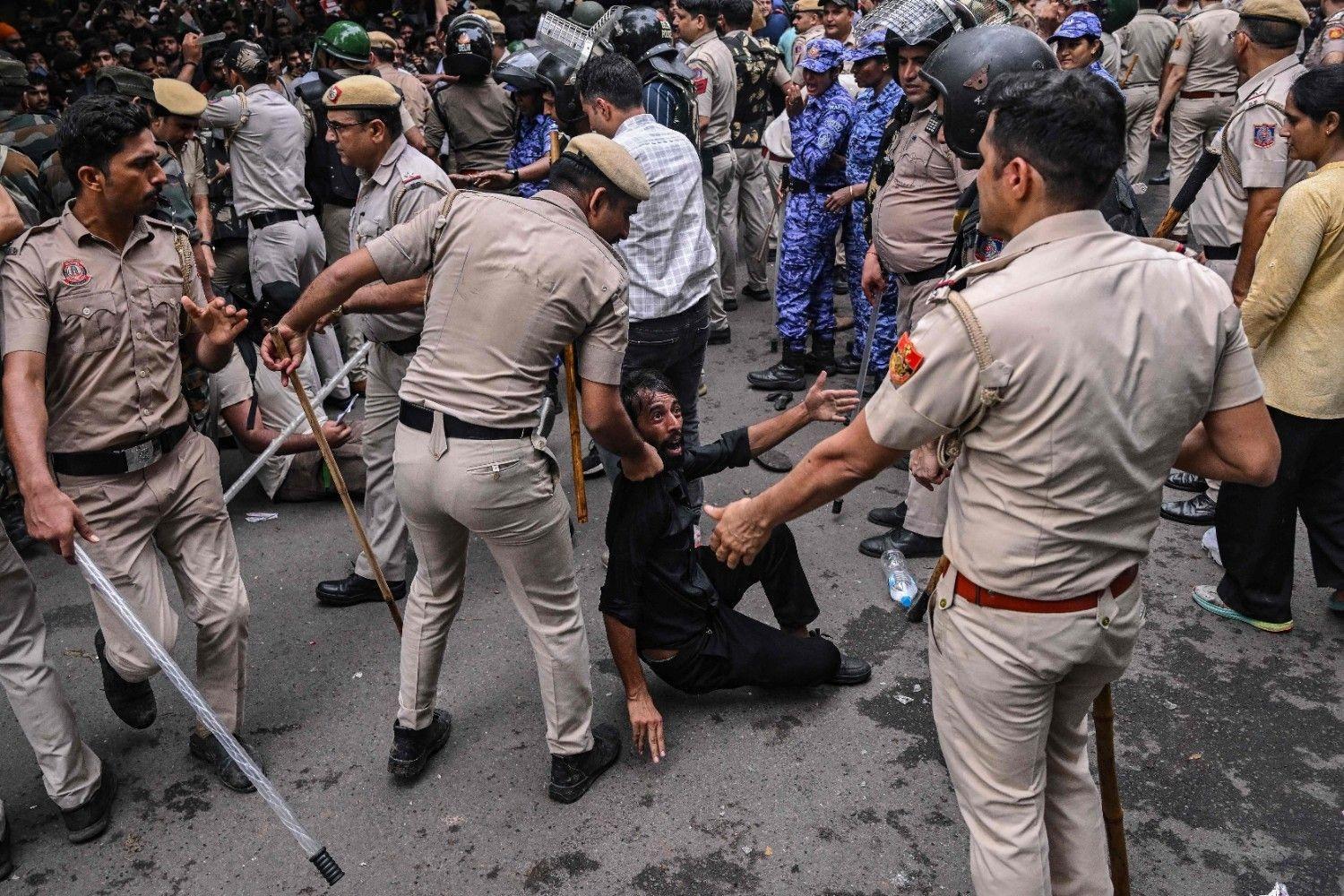 Indian police fire tear gas on exam protesters