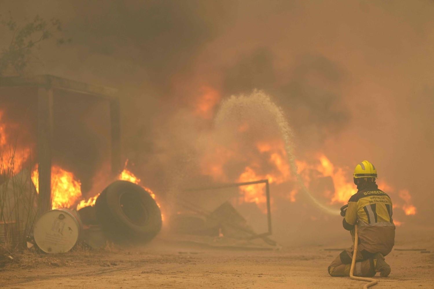More than 160,000 flee out-of-control wildfires in France, Spain
