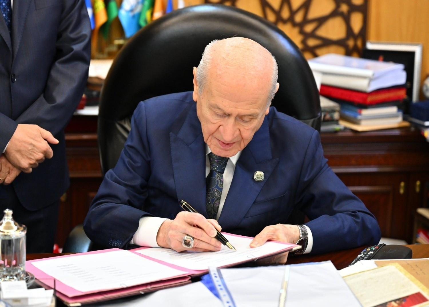 Bahçeli first to sign bill tied to anti-terror initiative