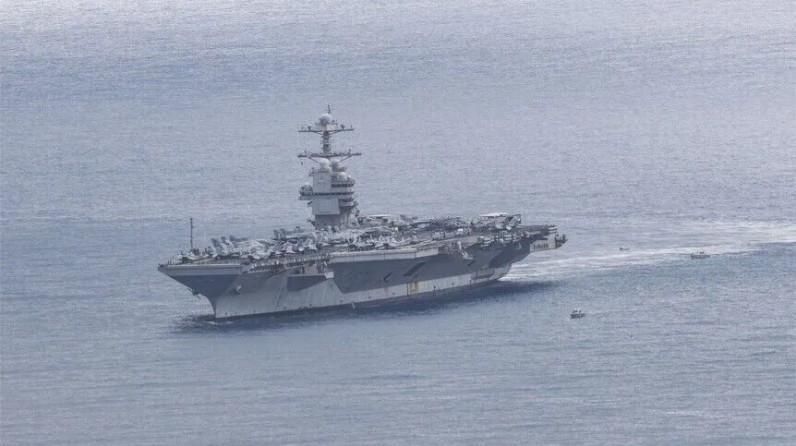 Iran claims missile strikes on US carrier, destroyer