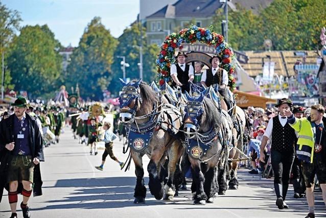 Munich’s Oktoberfest roars to life as the mayor taps first keg