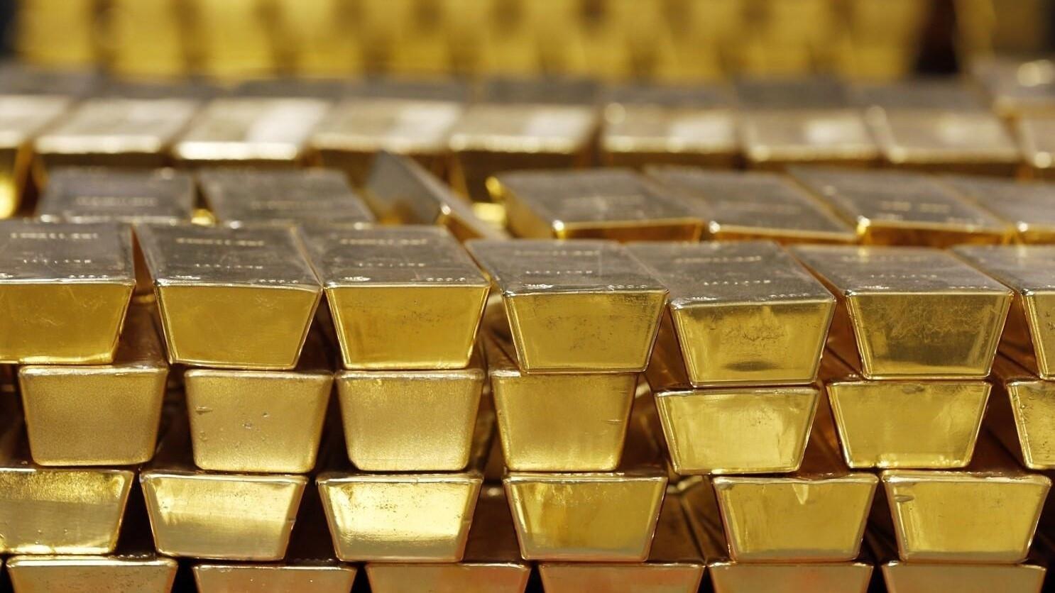 Gold slips as dollar and bond yields weigh