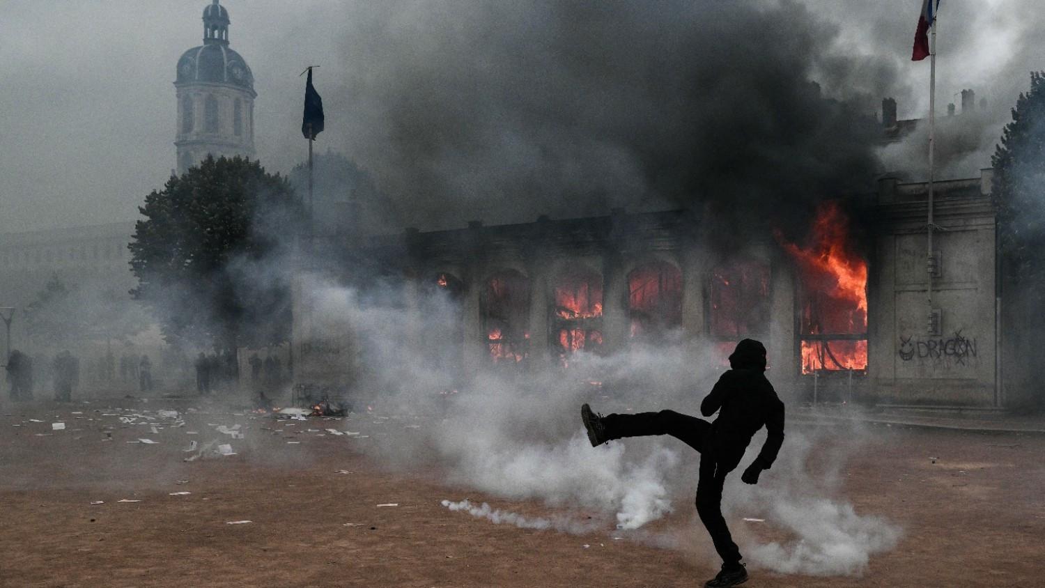 France counts cost of violent protests, 1,800 arrested