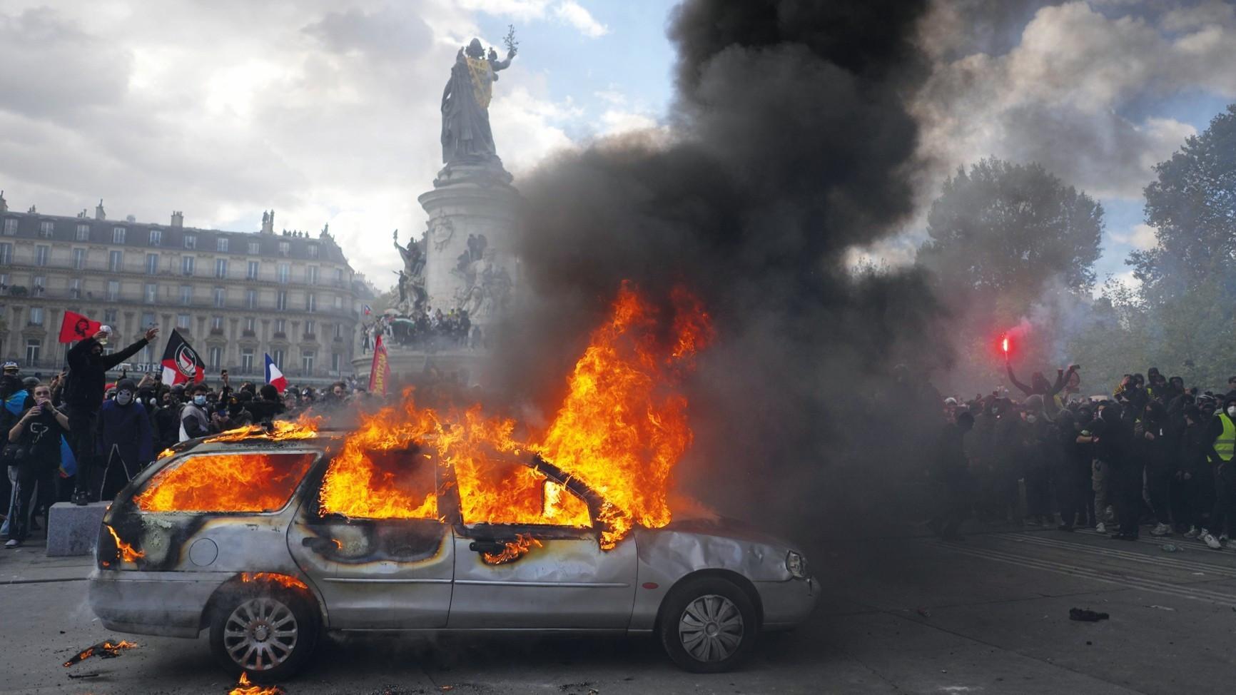 Protests banned in parts of Paris as Macron swipes at Trump