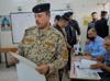 Iraqi forces, displaced people vote early ahead of election