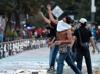 Clashes injure 120 at protest against Mexico president
