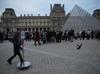 Hundreds queue at Louvre museum as strike vote delays opening