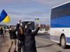 Ukrainians greet POWs with tears and cheers
