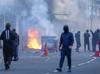Protesters torch buildings and vehicles, block roads over Belfast stabbing