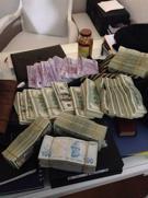 Photos of alleged bribery money seized in house of Turkish minister’s son revealed