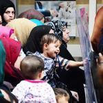 Hundreds of Syrians stampede to get refugee IDs in western Turkey