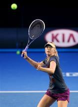 Sharapova serves more bagels as Stosur chokes