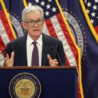 US Fed holds interest rates steady, defying Trump pressure