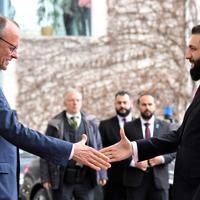 Germany tries to play down row over Syria refugee return