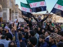Syrians flood streets to celebrate end of Assad rule