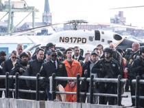 Suspect in health CEO killing charged with murder in New York