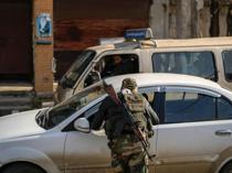 Syrian forces target pro-Assad fighters after deadly clashes