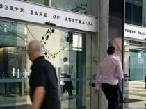 Australian central bank cuts key rate, warns of uncertainty