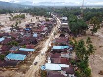 Race to get aid to Asia flood survivors as toll tops 1,200