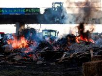 Macron meets French farmers in bid to defuse anger over trade deal